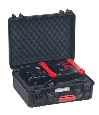 Portable electrical testing device in black case with foam padding.