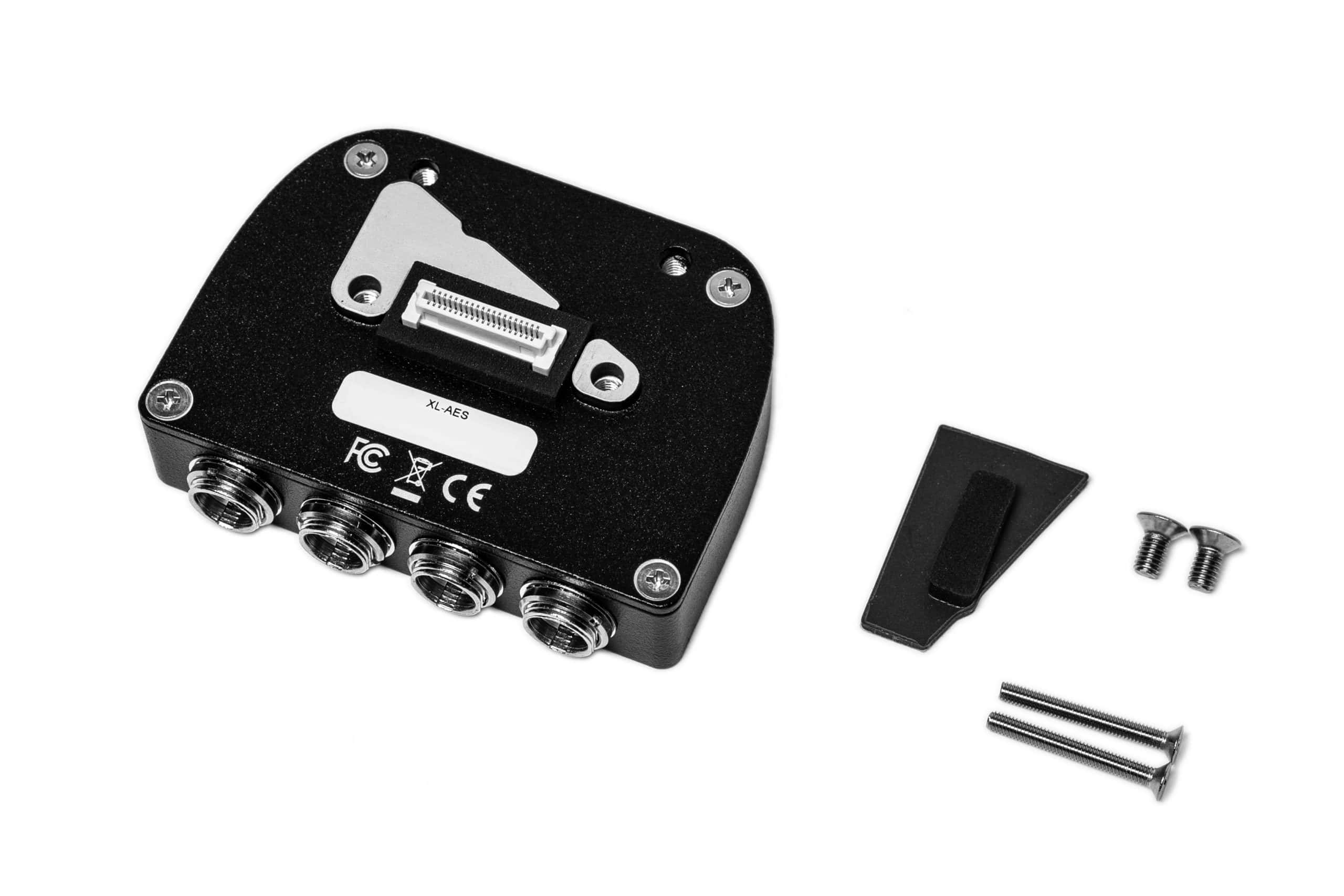 Black fiber optic splitter with mounting accessories and screws for installation.